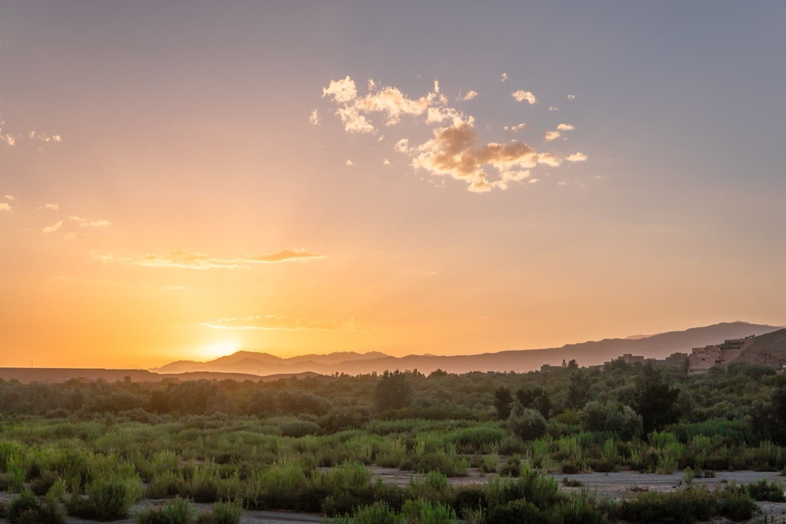 Warm sunset over the Ouarzazate countryside marking the end of summer in Morocco