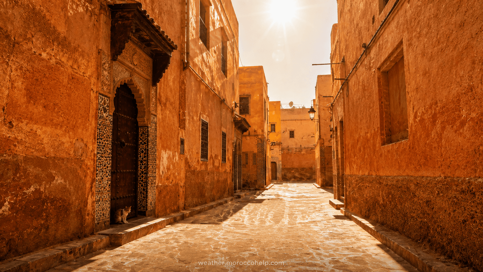Empty midday street in a Moroccan city during an orange-level heatwave, August 4, 2026