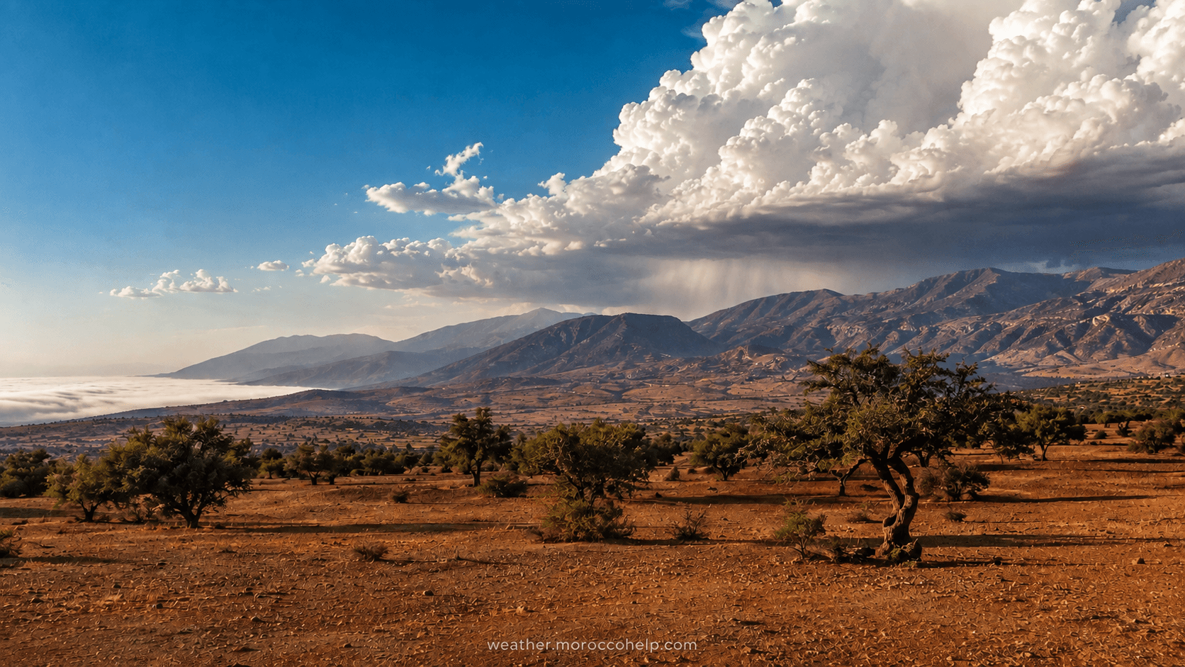 Hot summer afternoon over the Moroccan interior, with haze building over the Atlas on August 3, 2026